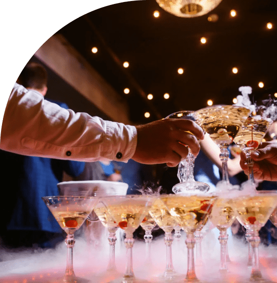 People clinking glasses in a celebratory toast at a party.
